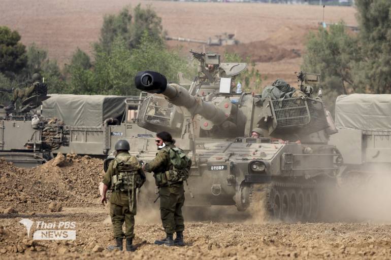 ทหารอิสราเอลเข้าประจำการในรถหุ้มเกราะ ใกล้ชายแดนฉนวนกาซาทางตอนใต้ของอิสราเอล